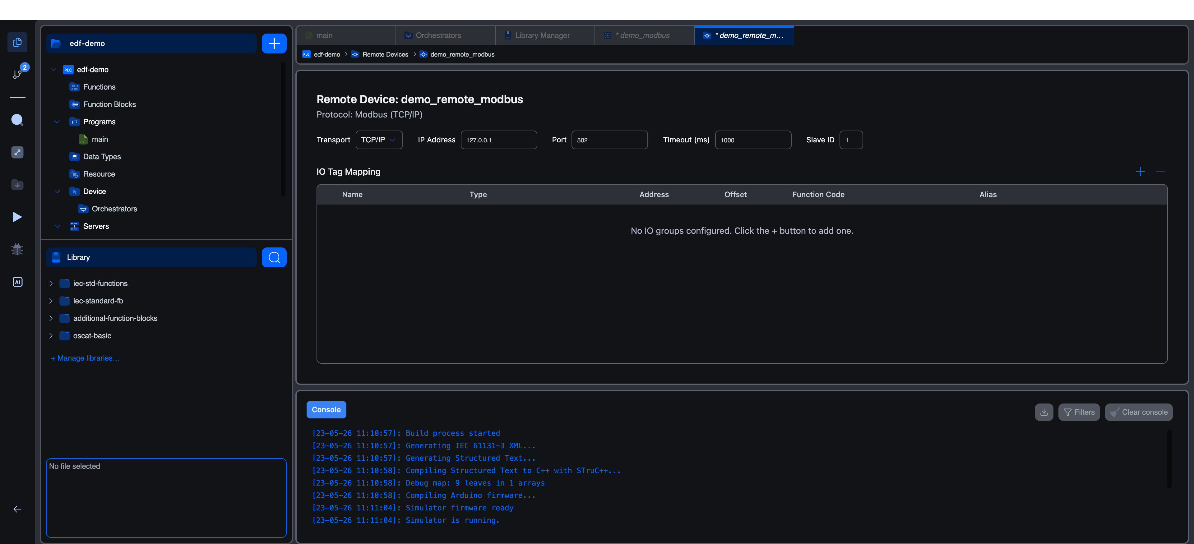 Remote Device editor for demo_remote_modbus: Transport TCP/IP, IP Address 127.0.0.1, Port 502, Timeout 1000ms, Slave ID 1, plus an empty IO Tag Mapping table with the message "No IO groups configured. Click the + button to add one"