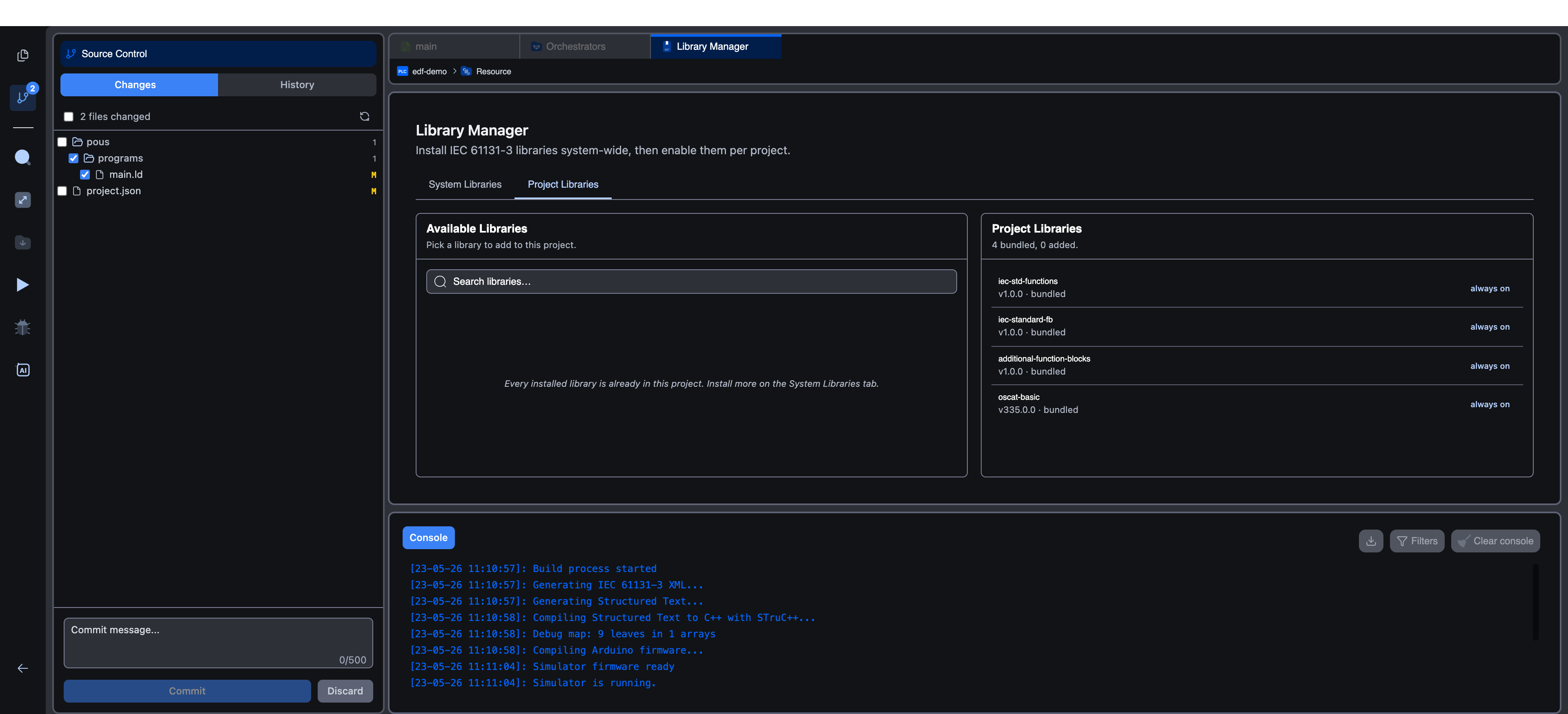 Source Control panel showing the Changes tab with two modified files (main.ld and project.json), a tree view grouped by folder, and the commit message textarea + Commit / Discard buttons at the bottom